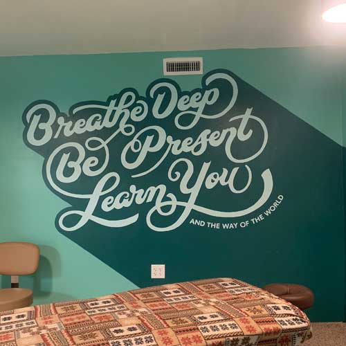 To spruce up their massage room, we created a calming mural to help clients relax and stay present in the moment, getting the most out of their massage.